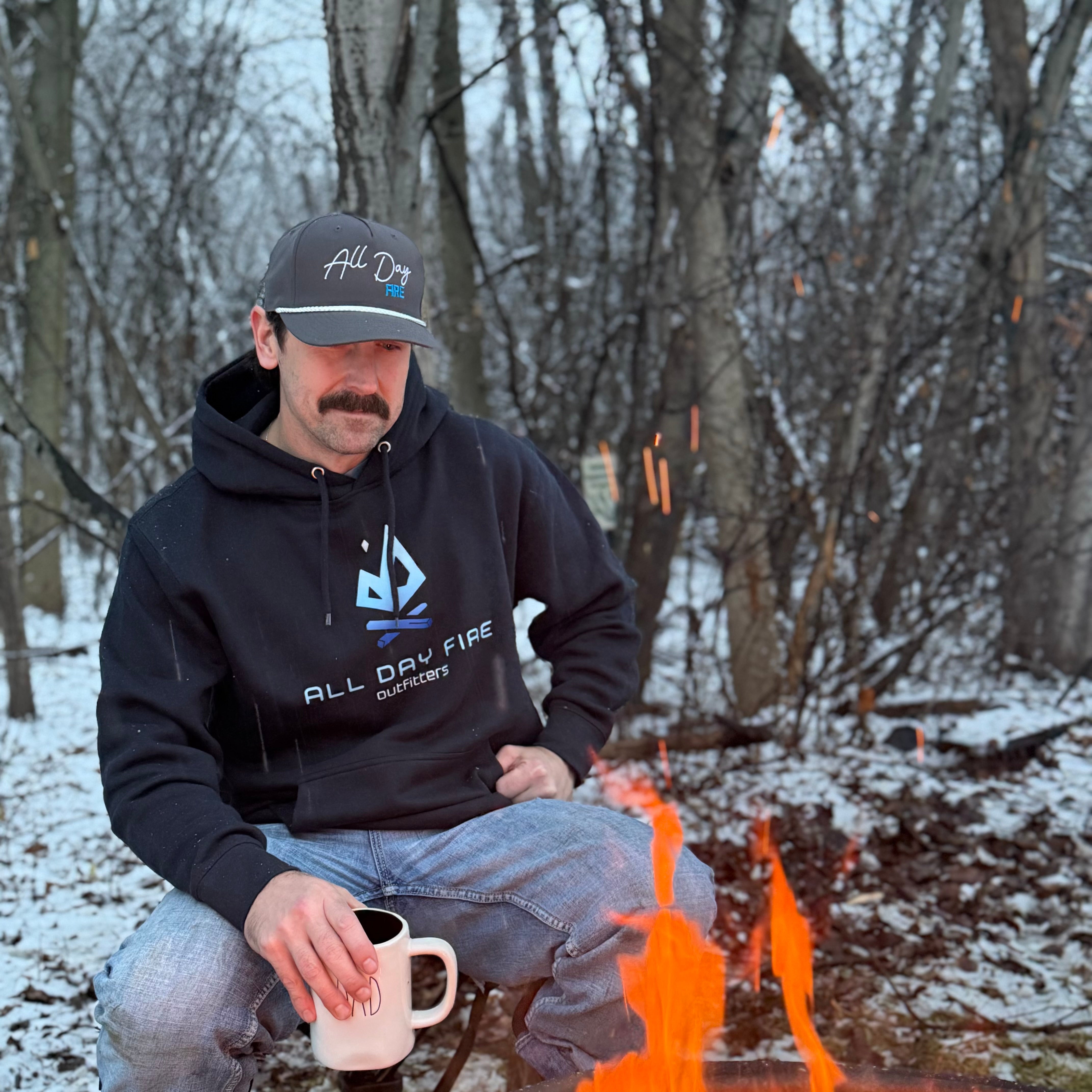 Navy camping hoodie featuring the All Day Fire Outfitters logo in blue gradient. Comfortable hoodie made for campfire nights and adventure days.