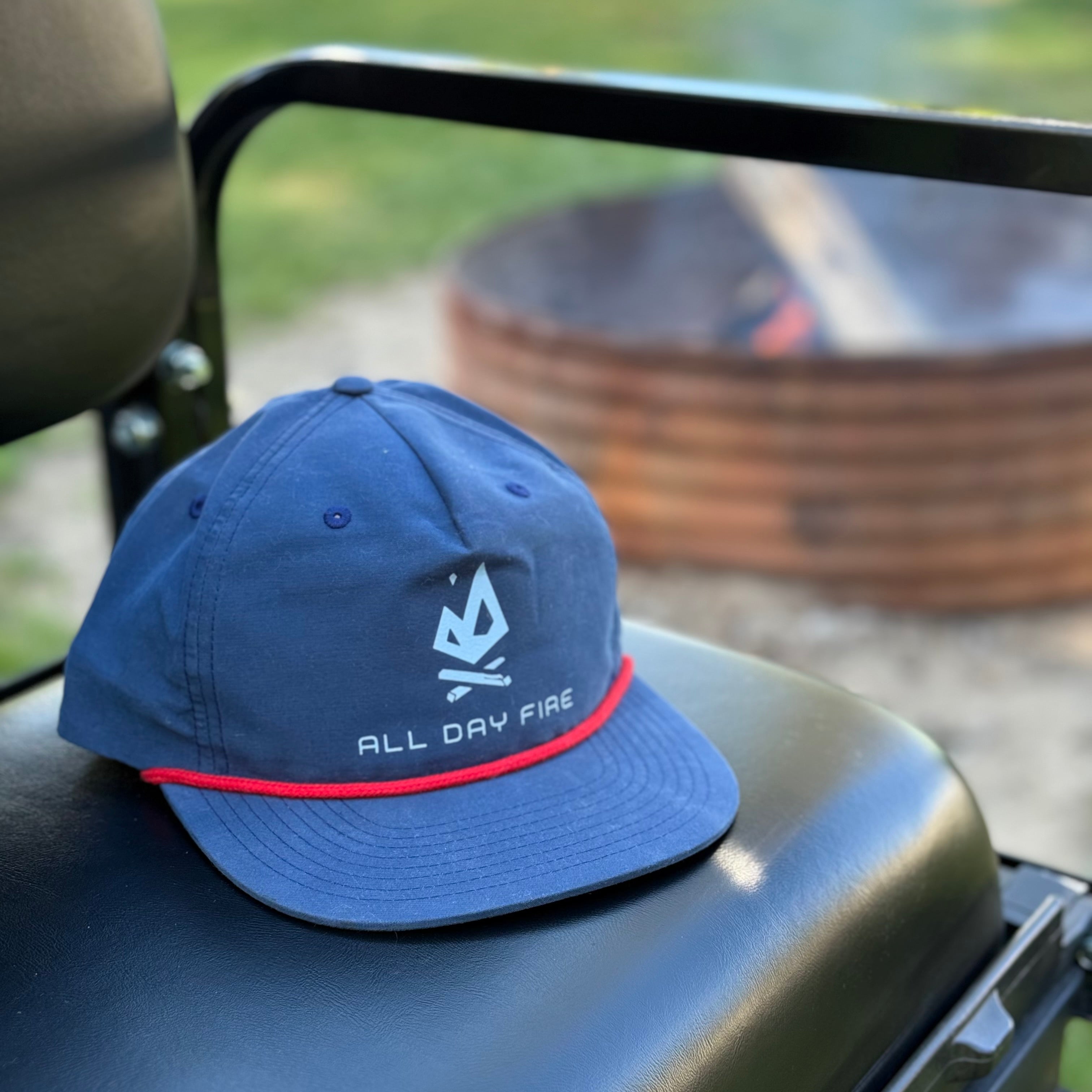 Navy Richardson 256 ropestyle snapback featuring the Columbia Blue All Day Fire Outfitters logo. Outdoor hat available with white or red rope detail.