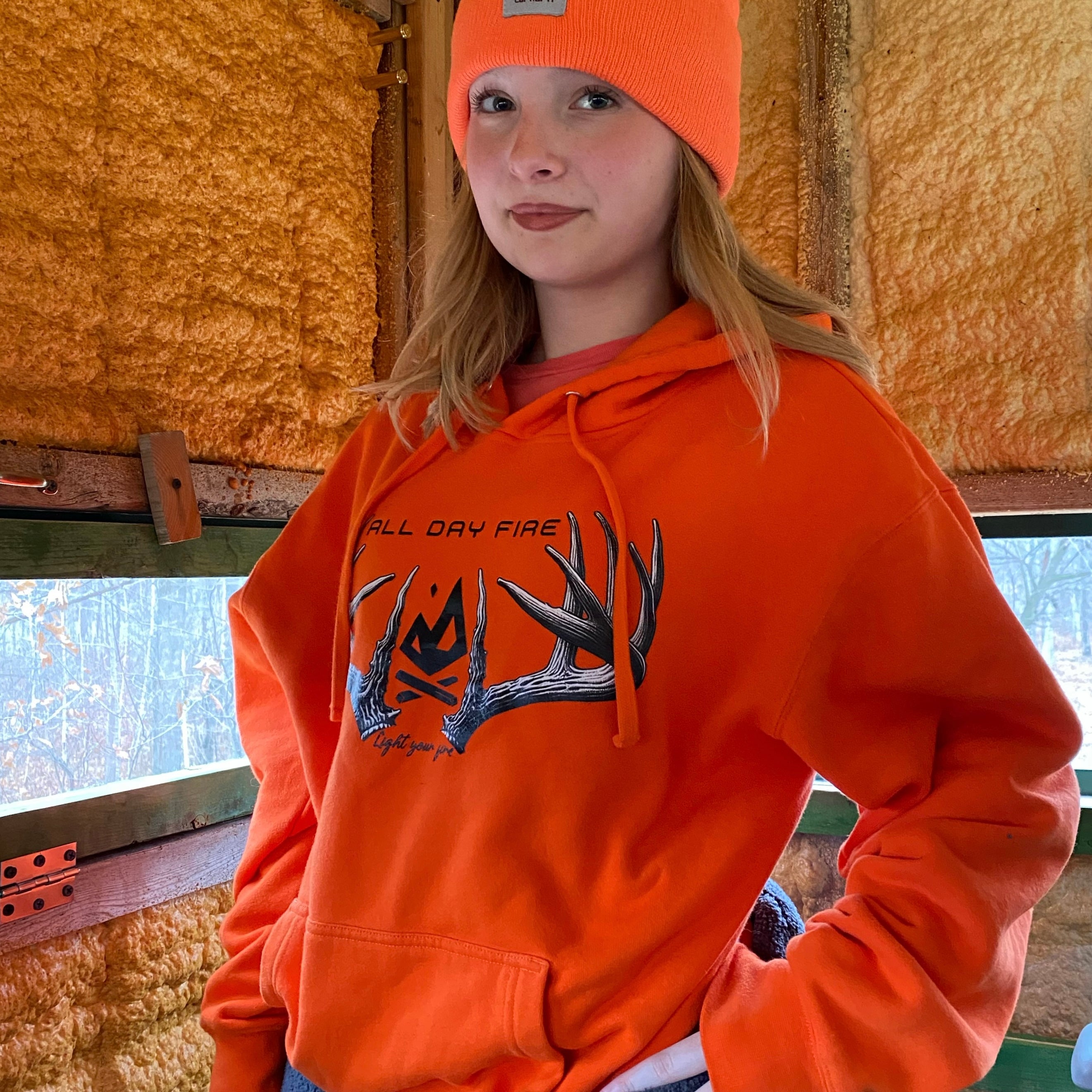 All Day Fire Outfitters Deer Camp Hoodie worn in the woods during deer camp, representing family, adventure, and the outdoors.