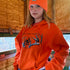 All Day Fire Outfitters Deer Camp Hoodie worn in the woods during deer camp, representing family, adventure, and the outdoors.