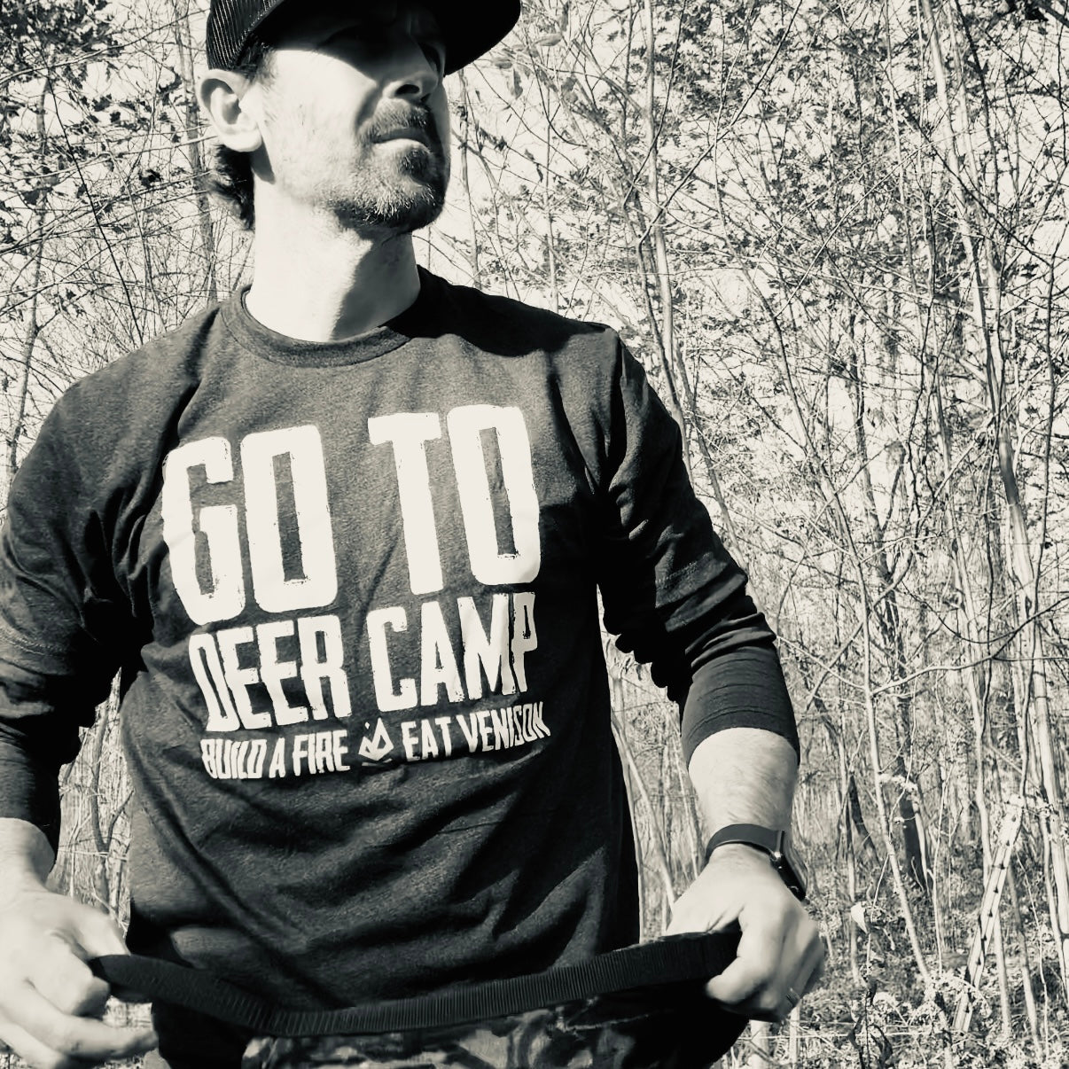 Vintage black All Day Fire Outfitters Go To Deer Camp t-shirt worn outdoors. Perfect for camping, hunting, and deer camp traditions.