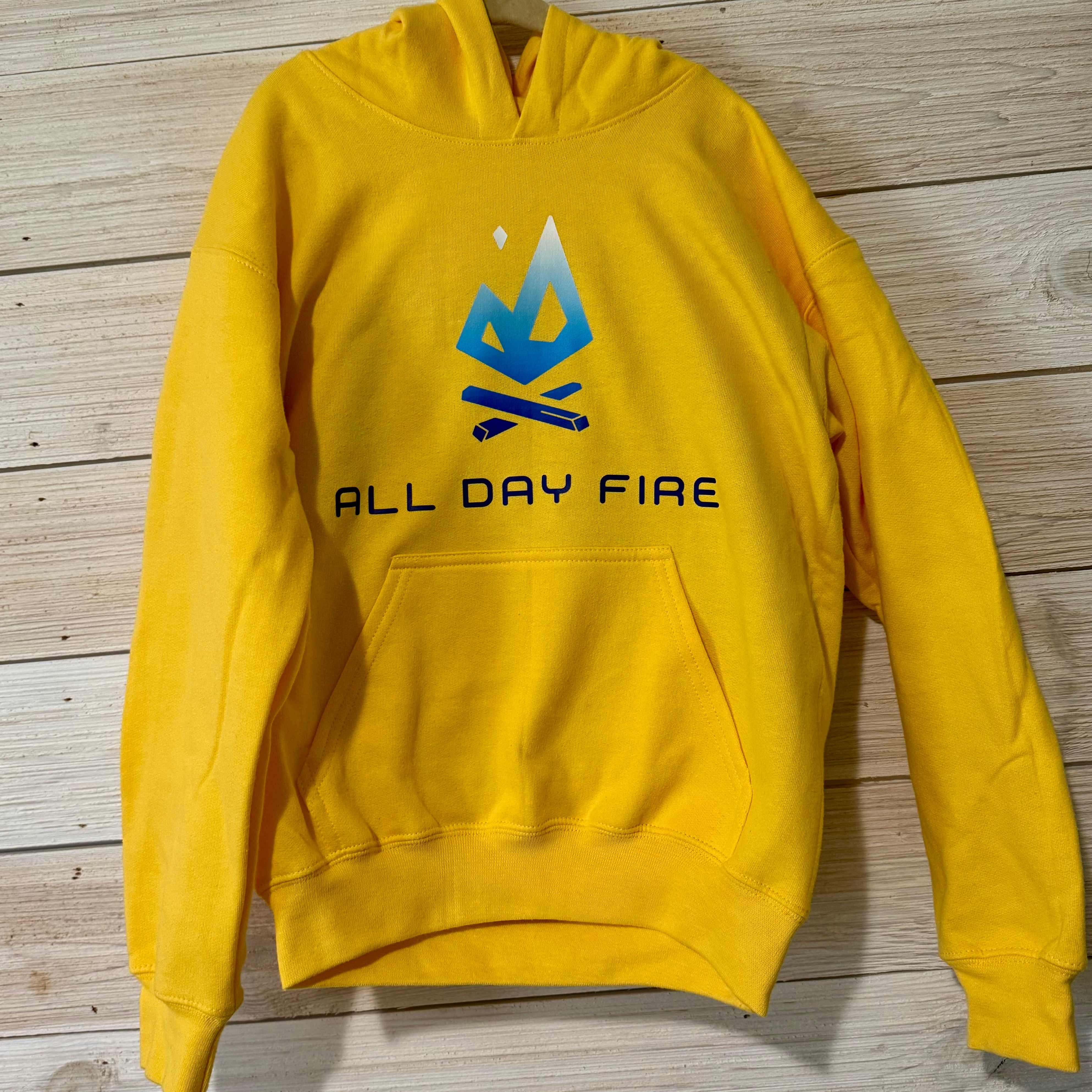 Daisy yellow youth camping hoodie with bold All Day Fire Outfitters logo on front. Soft cotton poly blend made for outdoor comfort and family adventures.