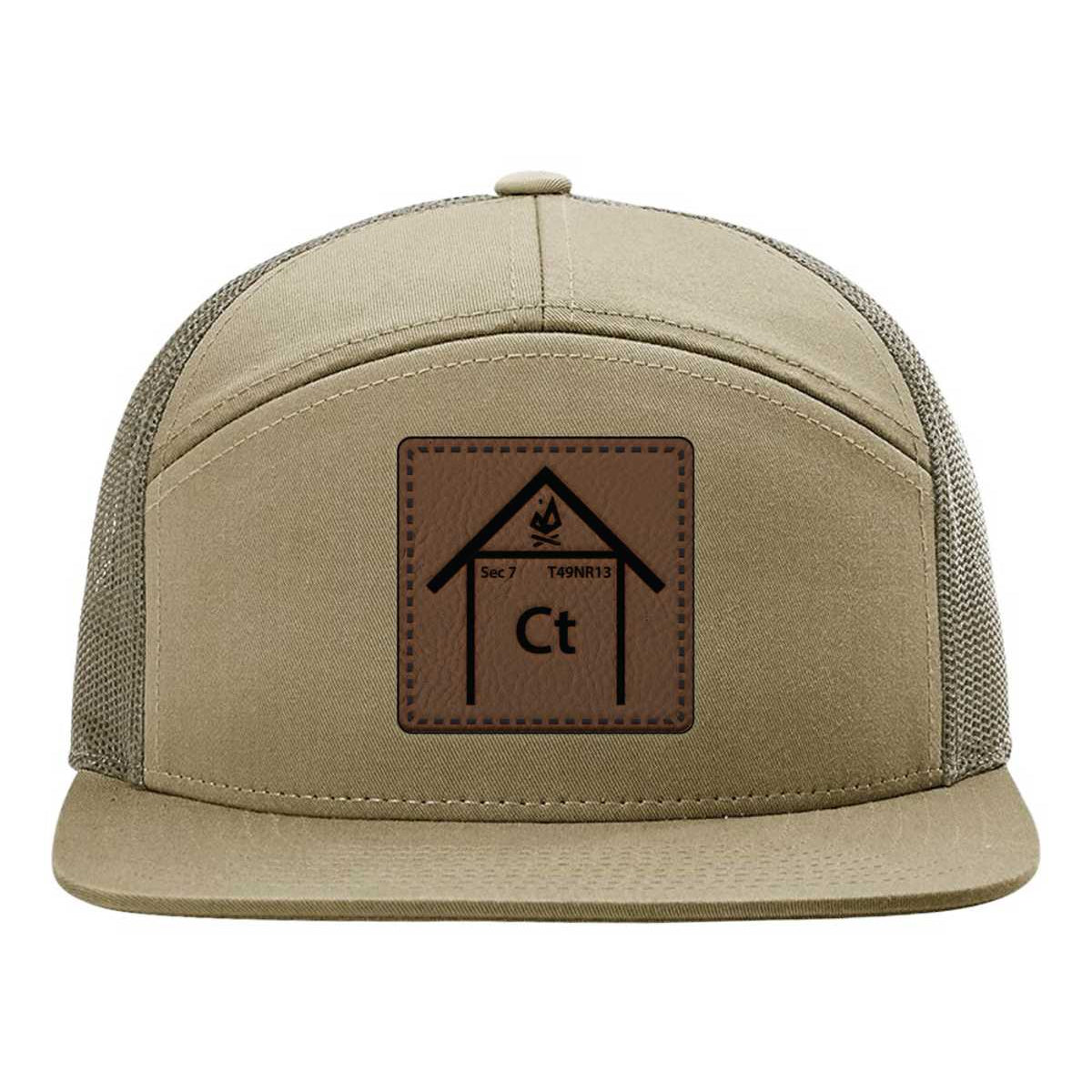 Copper Top Edition leather patch hat on a Richardson 168 7-panel. Pale khaki front with loden green mesh back, designed for camping and outdoor living.