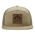 Copper Top Edition leather patch hat on a Richardson 168 7-panel. Pale khaki front with loden green mesh back, designed for camping and outdoor living.