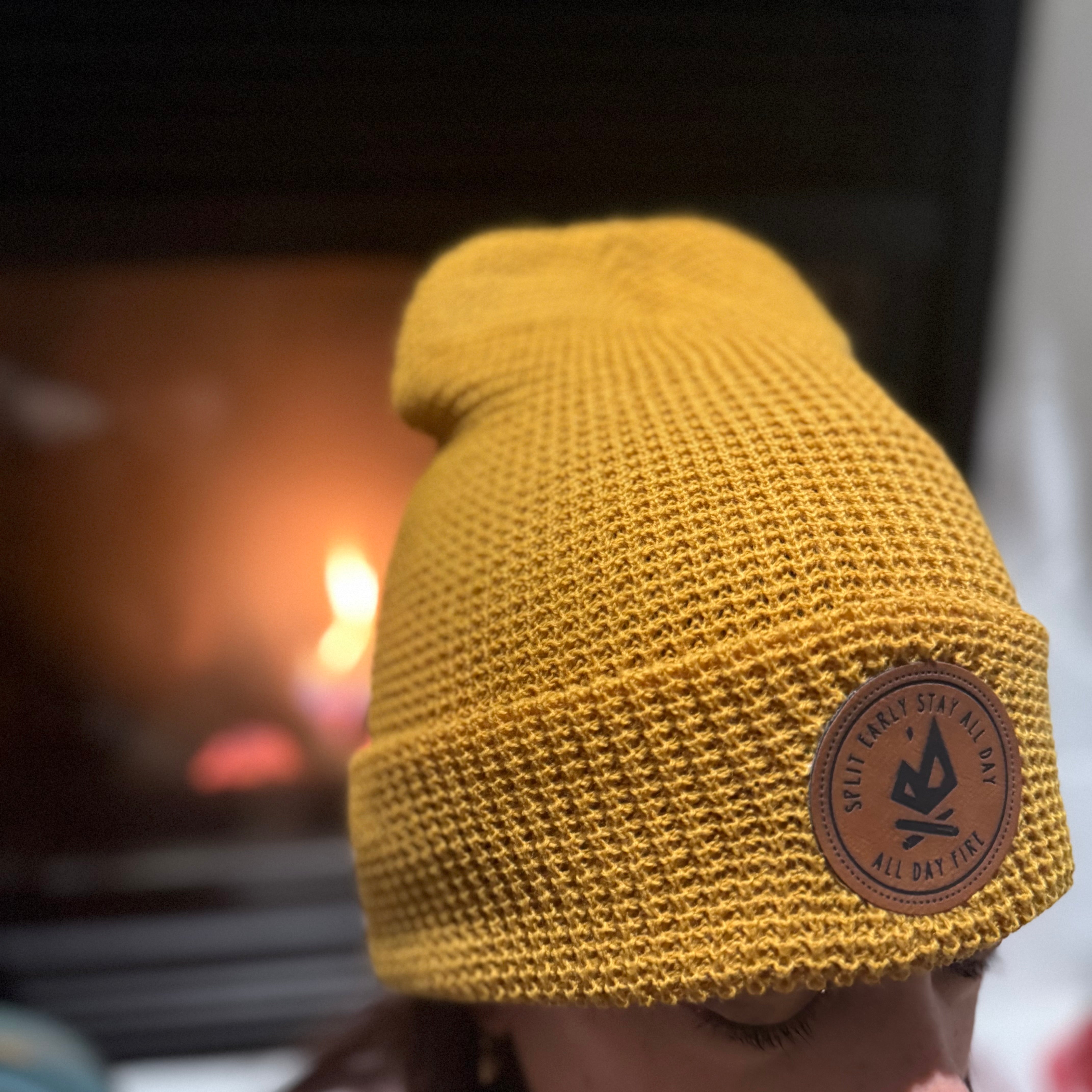 Camel waffle knit beanie with leather Split Early Stay All Day patch.