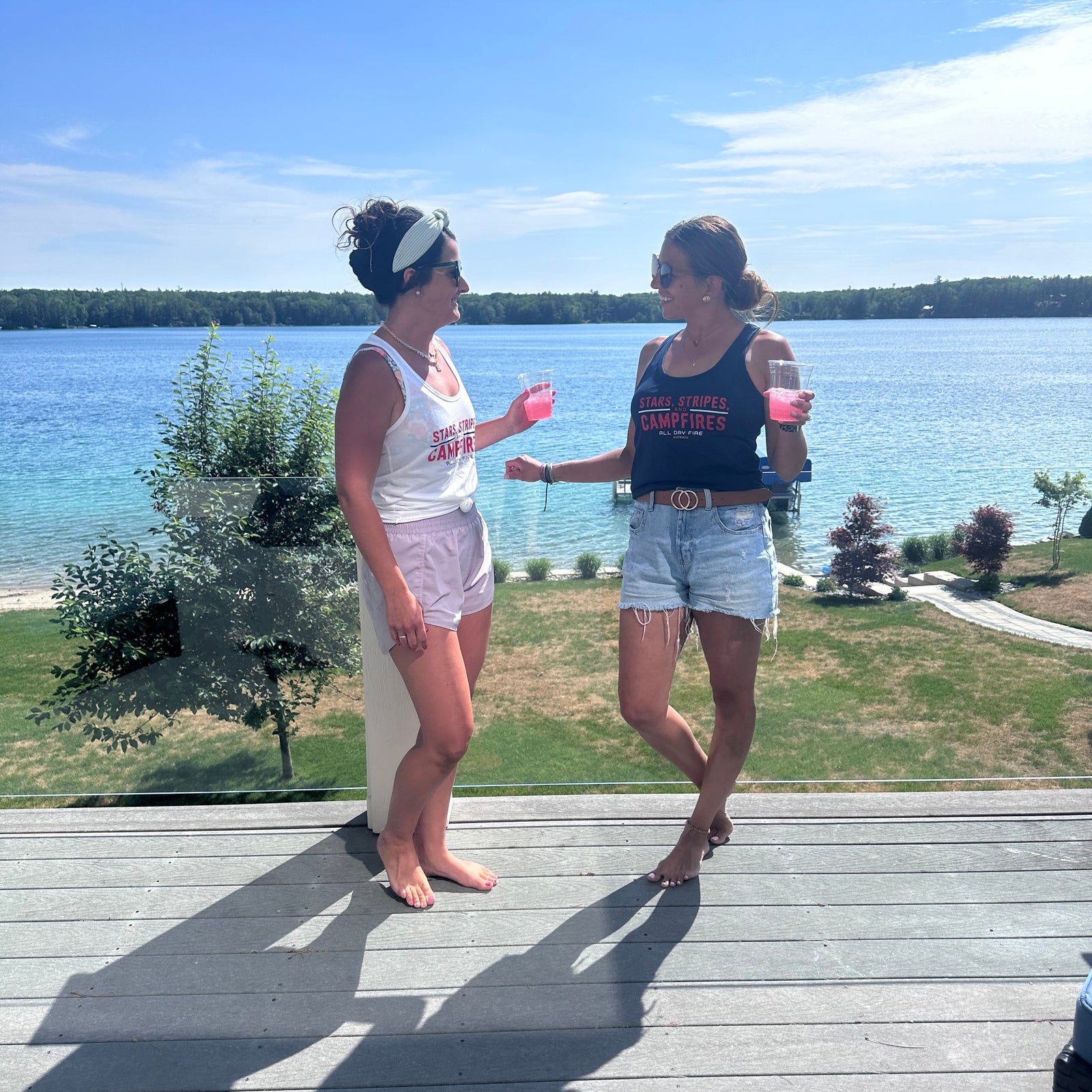 Stars Stripes and Campfires racerback tank styled for lake days, fireworks, camping trips, and summer campfire nights.